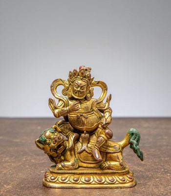 Lot 34 - A GILT BRONZE JAMBHALA, CHINA QING DYNASTY (1644–1911)