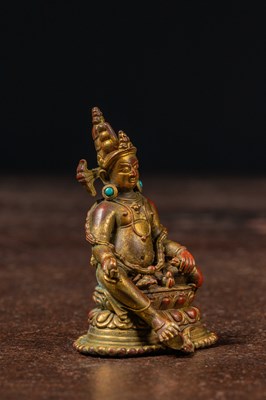 Lot 17 - A SEATED BRONZE GILT JAMBHALA TIBET 13TH CENTURY STYLE BUT LATER