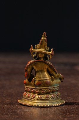 Lot 17 - A SEATED BRONZE GILT JAMBHALA TIBET 13TH CENTURY STYLE BUT LATER