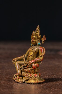 Lot 17 - A SEATED BRONZE GILT JAMBHALA TIBET 13TH CENTURY STYLE BUT LATER