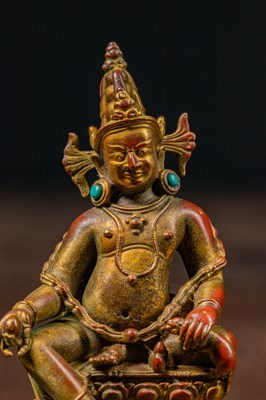 Lot 17 - A SEATED BRONZE GILT JAMBHALA TIBET 13TH CENTURY STYLE BUT LATER