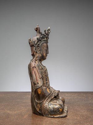 Lot 9 - A SEATED BRONZE FIGURE OF GUANYIN, CHINA, MING DYNASTY, 16TH CENTURY