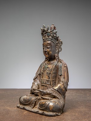 Lot 9 - A SEATED BRONZE FIGURE OF GUANYIN, CHINA, MING DYNASTY, 16TH CENTURY