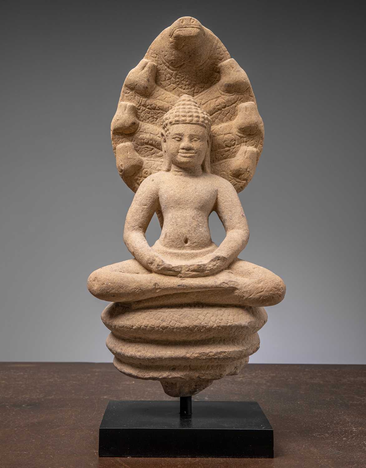 Lot 52 - SANDSTONE NAGA BUDDHA 11TH CENTURY BAPHUAN PERIOD