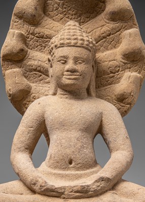 Lot 52 - SANDSTONE NAGA BUDDHA 11TH CENTURY BAPHUAN PERIOD