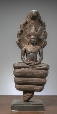 Lot 170 - A DARK STONE NAGA BUDDHA CAMBODIA ANGKOR WAT PERIOD 12TH CENTURY