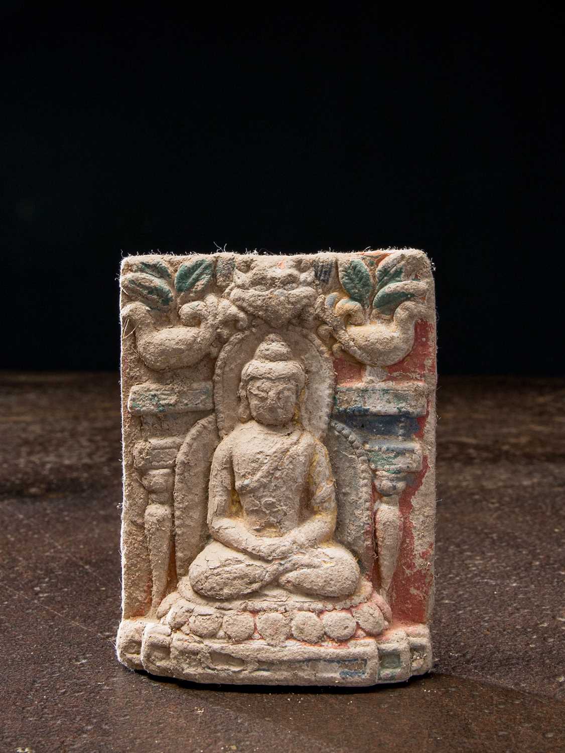 Lot 15 - A CHINESE POLYCHROME CLAY TSA TSA OF BUDDHA 13TH TO 15TH CENTURY