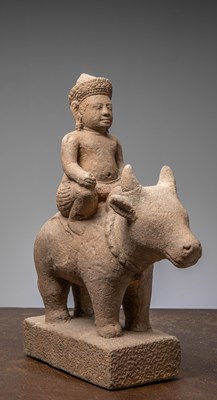 Lot 383 - A SANDSTONE FIGURE OF SKANDA RIDING NANDI, KHMER EMPIRE, ANGKOR PERIOD 12TH CENTURY