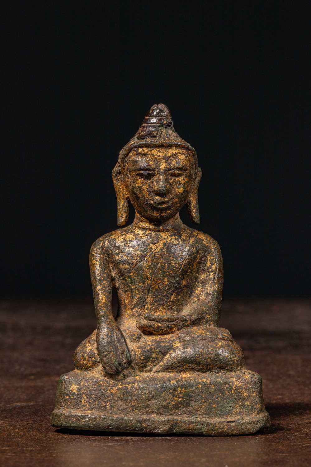 Lot 60 - SEATED RESTGILT BRONZE BUDDHA BIRMA 15TH CENTURY