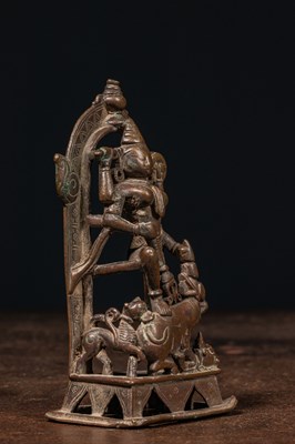 Lot 83 - A BRONZE FIGURE OF DURGA SLAYING THE BUFFALO DEMON (MAHIṢĀSURAMARDINĪ) INDIA 17TH CENTURY