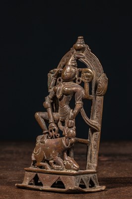 Lot 83 - A BRONZE FIGURE OF DURGA SLAYING THE BUFFALO DEMON (MAHIṢĀSURAMARDINĪ) INDIA 17TH CENTURY