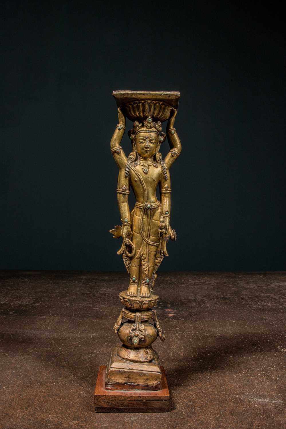 Lot 22 - A GILT-BRONZE DOUBLE-SIDED OFFERING GODDESS FROM A DENSATIL MONASTERY PILLAR TIBET 14TH CENTURY