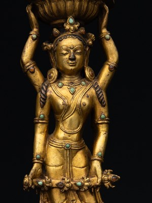 Lot 22 - A GILT-BRONZE DOUBLE-SIDED OFFERING GODDESS FROM A DENSATIL MONASTERY PILLAR TIBET 14TH CENTURY