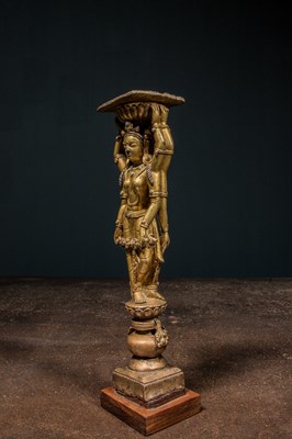 Lot 22 - A GILT-BRONZE DOUBLE-SIDED OFFERING GODDESS FROM A DENSATIL MONASTERY PILLAR TIBET 14TH CENTURY