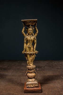 Lot 22 - A GILT-BRONZE DOUBLE-SIDED OFFERING GODDESS FROM A DENSATIL MONASTERY PILLAR TIBET 14TH CENTURY