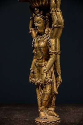 Lot 22 - A GILT-BRONZE DOUBLE-SIDED OFFERING GODDESS FROM A DENSATIL MONASTERY PILLAR TIBET 14TH CENTURY
