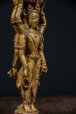 Lot 22 - A GILT-BRONZE DOUBLE-SIDED OFFERING GODDESS FROM A DENSATIL MONASTERY PILLAR TIBET 14TH CENTURY