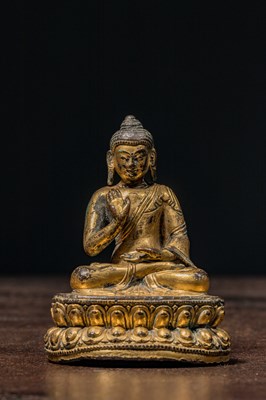Lot 148 - SEATED GILT BRONZE BUDDHA TIBET 16TH CENTURY