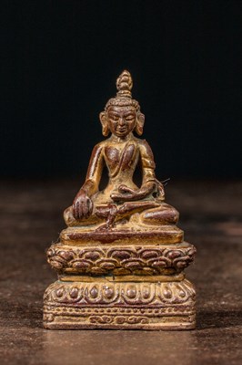 Lot 215 - SEATED BRONZE GILT BUDDHA NEPAL 16TH CENTURY