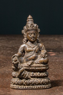 Lot 121 - SEATED STONE JAMBHALA NEPAL 19TH CENTURY OR EARLIER