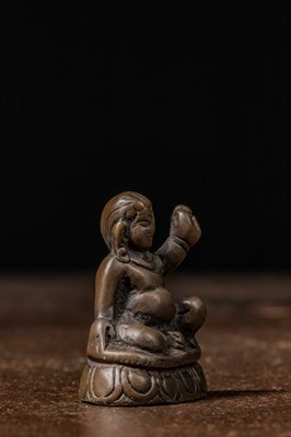 Lot 73 - A MINIATURE BRONZE FIGURE OF A MAHASIDDHA, PROBABLY VIRŪPA TIBET 13TH CENTURY