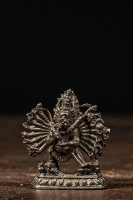 Lot 213 - MINIATURE SILVER MAHAKALA SCULPTURE OF A GAU TIBET 19TH CENTURY