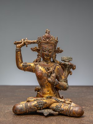 Lot 268 - A SEATED BRONZE MANJUSRI, NEPAL, 15TH CENTURY