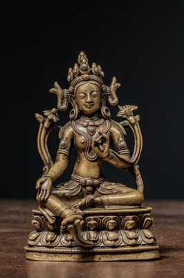 Lot 125 - SETAED BRONZE TARA WITH COPPER AND SILVER INLYAS TIBET 15TH CENTURY