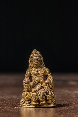 Lot 101 - SEATED BRONZE GILT JAMBHALA TIBET 16TH CENTURY