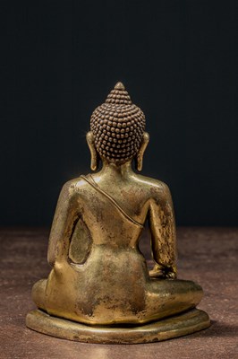 Lot 80 - A GILT BRONZE FIGURE OF BUDDHA IN PĀLA REVIVAL STYLE TIBET 18TH CENTURY