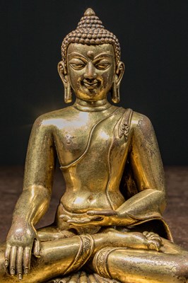 Lot 80 - A GILT BRONZE FIGURE OF BUDDHA IN PĀLA REVIVAL STYLE TIBET 18TH CENTURY