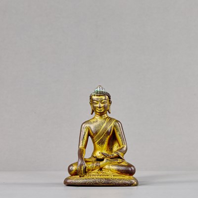 Lot 236 - A SEATED BRONZE GILT BUDDHA, TIBET, 15TH CENTURY