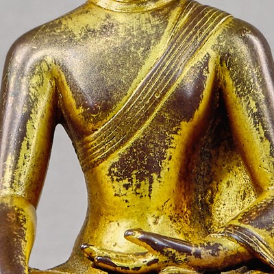 Lot 318 - A SEATED BRONZE GILT BUDDHA, TIBET, 15TH CENTURY