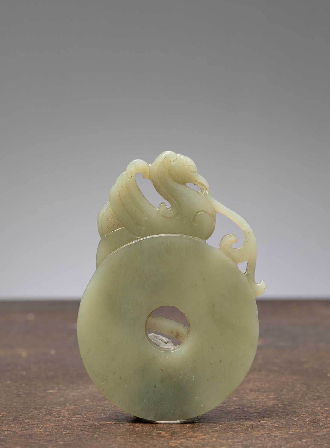 Lot 1 - (R) JADE CELADON BI-DISC WITH PHOENIX CHINA 18TH CENTURY