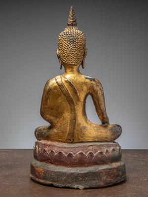 Lot 33 - (R) A GILT BRONZE FIGURE OF BUDDHA ON A LATER INSCRIBED BASE THAILAND AYUTTHYA (1600 - 1650)