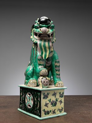 Lot 7 - (R) A RARE AND IMPRESSIVE SANCAI-GLAZED POTTERY FIGURE OF A BUDDHIST LION CHINA QING DYNASTY
