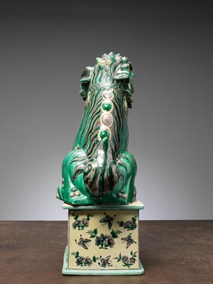 Lot 7 - (R) A RARE AND IMPRESSIVE SANCAI-GLAZED POTTERY FIGURE OF A BUDDHIST LION CHINA QING DYNASTY