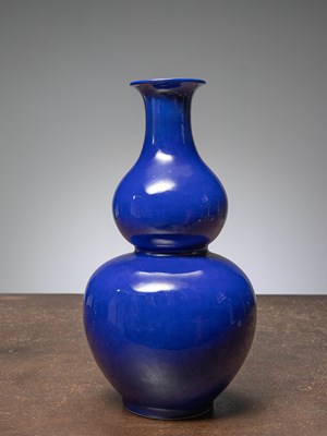 Lot 82 - (R) A MONOCHROME COBALT-BLUE DOUBLE GOURD VASE, CHINA, QING DYNASTY WITH QIANLONG MARK