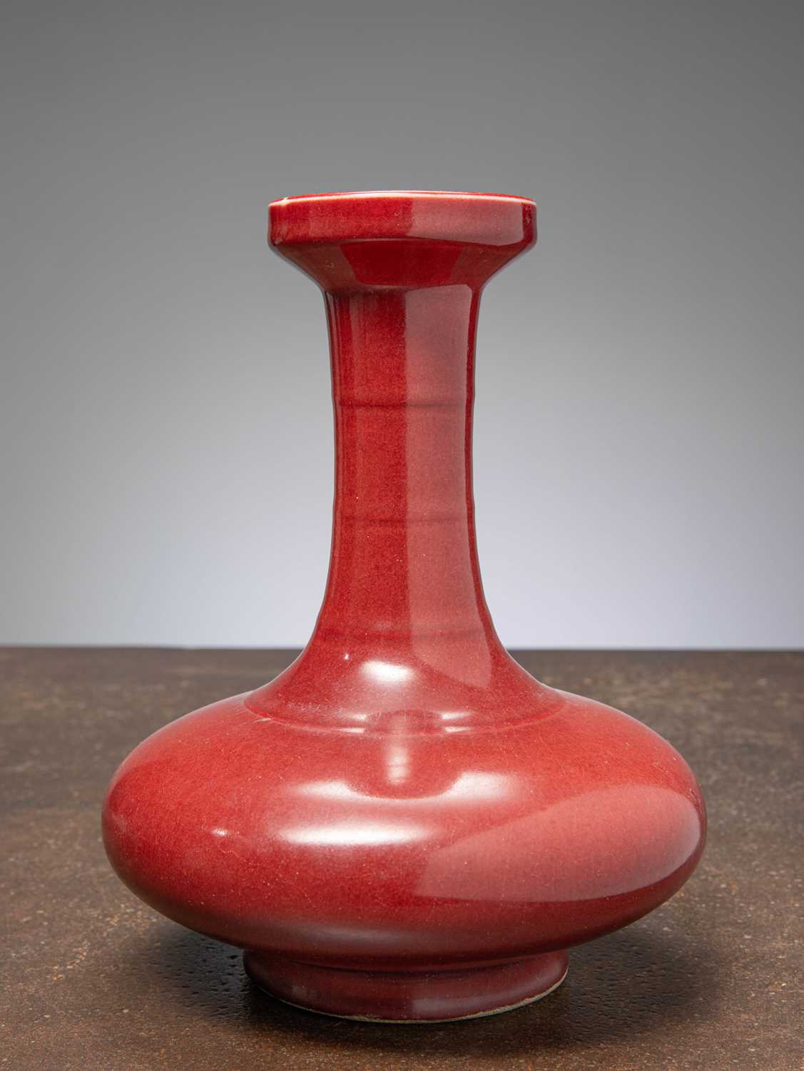 Lot 13 - (R) RARE BULBOUS LONG-NECK VASE BRICK RED GLAZE, QING DYNASTY CHINA