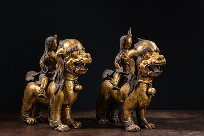 Lot 45 - (R) PAIR OF COPPER REPOUSSE GILT TEMPLE GUARDS ON FO-DOGS SINO-TIBETAN 17TH /18TH CENTURY