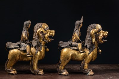 Lot 45 - (R) PAIR OF COPPER REPOUSSE GILT TEMPLE GUARDS ON FO-DOGS SINO-TIBETAN 17TH /18TH CENTURY