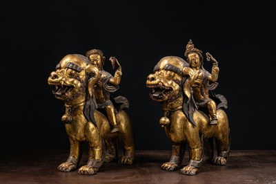 Lot 45 - (R) PAIR OF COPPER REPOUSSE GILT TEMPLE GUARDS ON FO-DOGS SINO-TIBETAN 17TH /18TH CENTURY