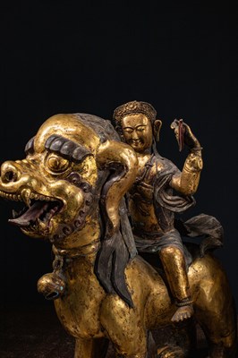 Lot 45 - (R) PAIR OF COPPER REPOUSSE GILT TEMPLE GUARDS ON FO-DOGS SINO-TIBETAN 17TH /18TH CENTURY