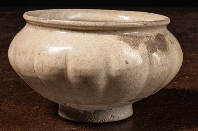 Lot 68 - (R) A YAOZHOU-TYPE CELADON BOWL WITH CRACKLED GLAZE, 10TH CENTURY SONG DYNASTY CHINA