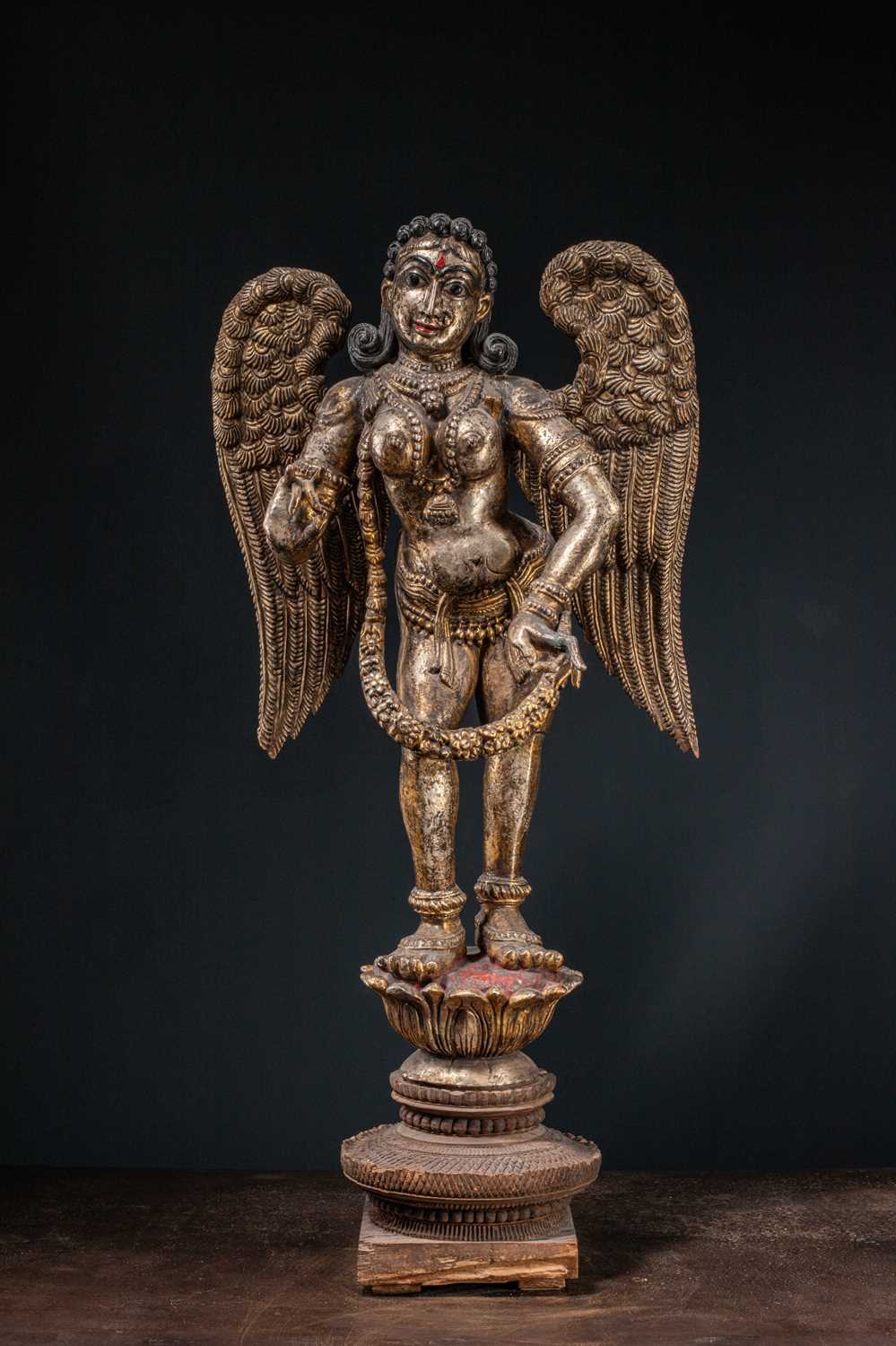 Lot 57 - (R) A LARGE CARVED AND GILT WOOD FIGURE OF AN ANGEL WEST-INDIA GOA ABOUT 1850'S