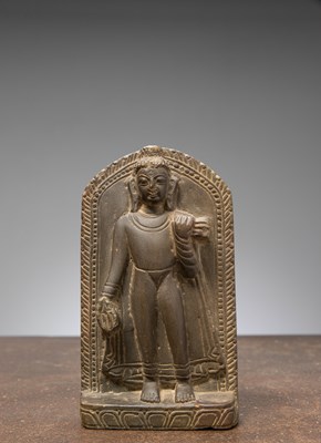 Lot 270 - (R) A STANDING STONE BUDDHA, NEPAL, 17TH CENTURY PALA REVIVAL