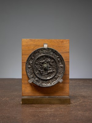 Lot 74 - (R) A BRONZE MIRROR WITH ANIMALS AND GRAPEVINES, TANG DYNASTY, CHINA 7TH TO 8TH CENTURY