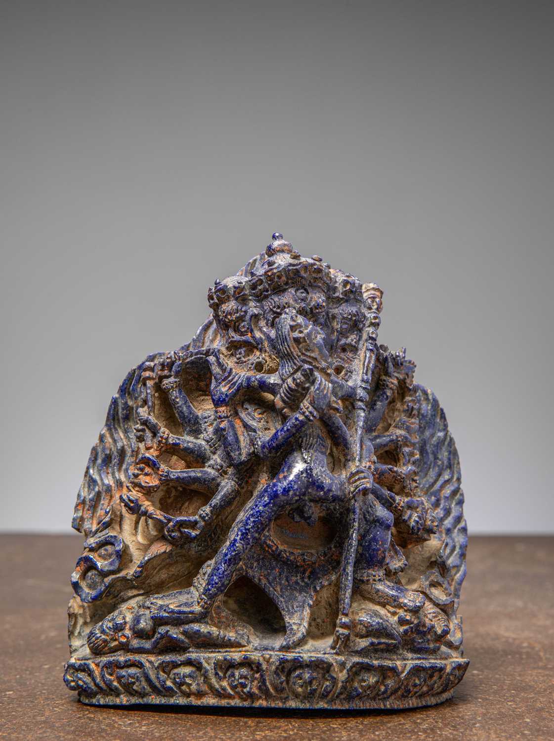 Lot 32 - (R) A RARE LAPIS LAZULI FIGURE OF HEVAJRA IN YAB-YUM TIBET 18TH CENTURY