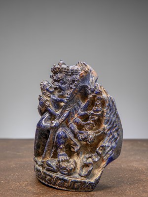 Lot 32 - (R) A RARE LAPIS LAZULI FIGURE OF HEVAJRA IN YAB-YUM TIBET 18TH CENTURY