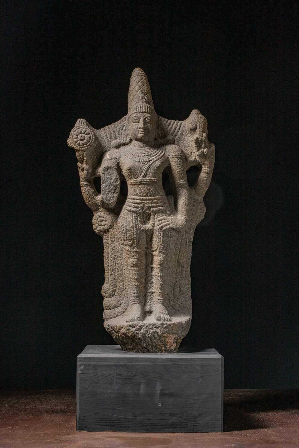 Lot 54 - (R) A FOUR-ARMED STANDING STONE VISHNU INDIA VIJAYANAGAR 15TH / 16TH CENTURY